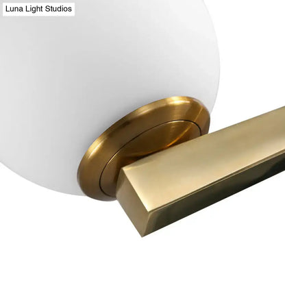 Modern white glass sphere wall light gold & black single light bedroom