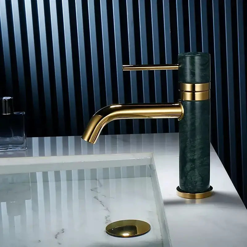 Modern white marble and brushed gold bathroom faucet with swivel spout
