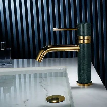 Modern white marble and brushed gold bathroom faucet with swivel spout