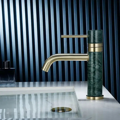 Modern white marble and brushed gold bathroom faucet with swivel spout