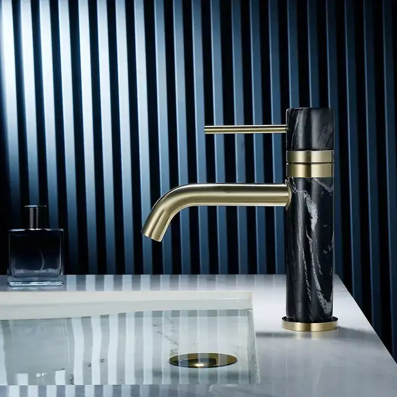 Modern white marble and brushed gold bathroom faucet with swivel spout