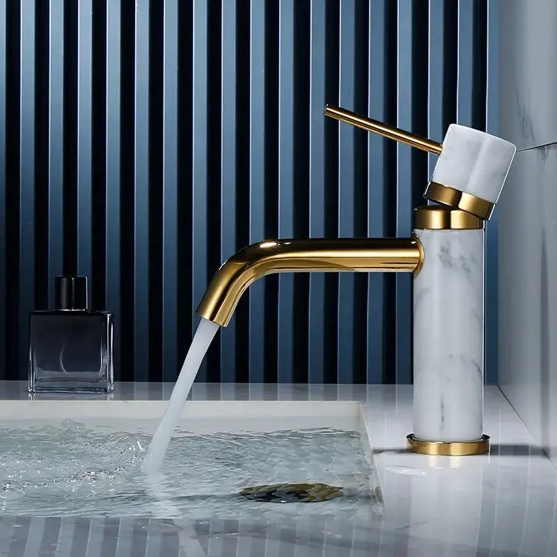 Modern white marble and brushed gold bathroom faucet with swivel spout