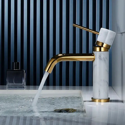 Modern white marble and brushed gold bathroom faucet with swivel spout