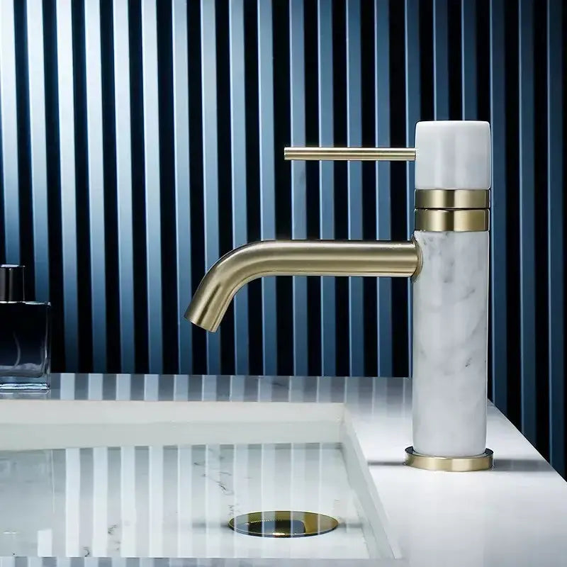 Modern white marble and brushed gold bathroom faucet with swivel spout