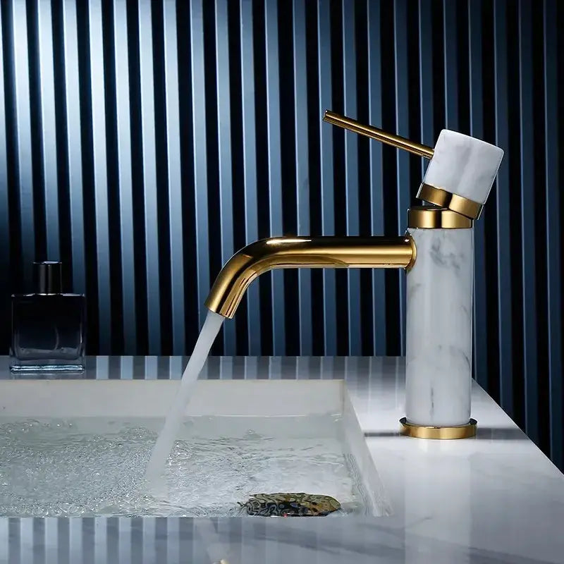 Modern white marble and brushed gold bathroom faucet with swivel spout