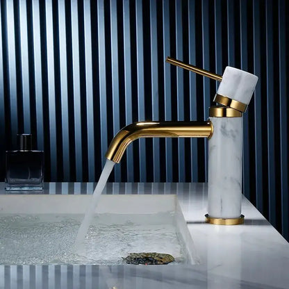Modern white marble and brushed gold bathroom faucet with swivel spout