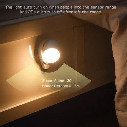 Modern white motion sensor rotating magnet night light for bedroom