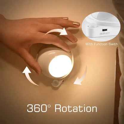 Modern white motion sensor rotating magnet night light for bedroom