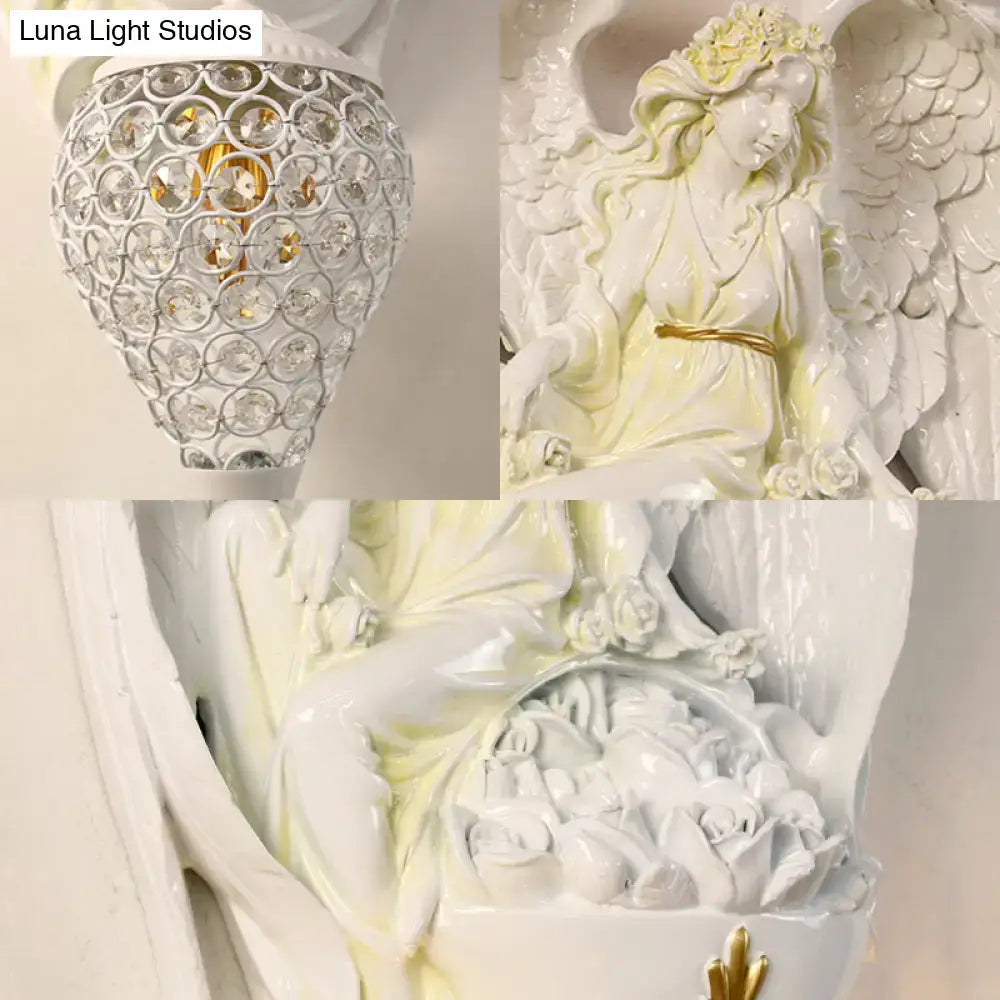 Modern white resin angel wall light with crystal shade bedroom