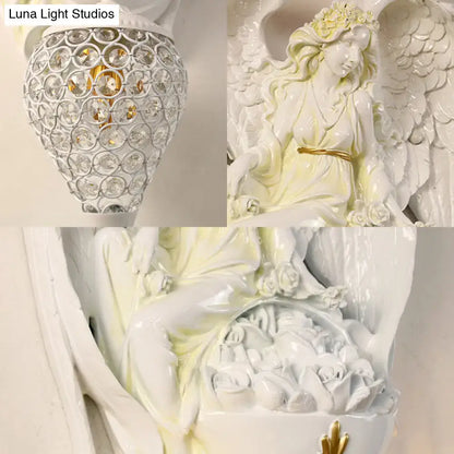 Modern white resin angel wall light with crystal shade bedroom
