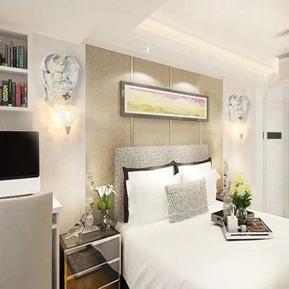Modern white resin angel wall light with crystal shade bedroom