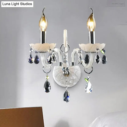 Modern white wall sconce light with teardrop crystal decoration living room
