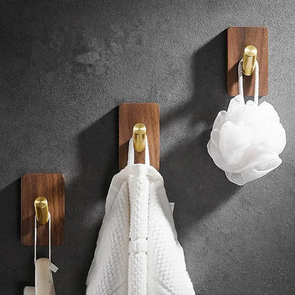 Modern wood and brushed gold wall hook row for kitchen
