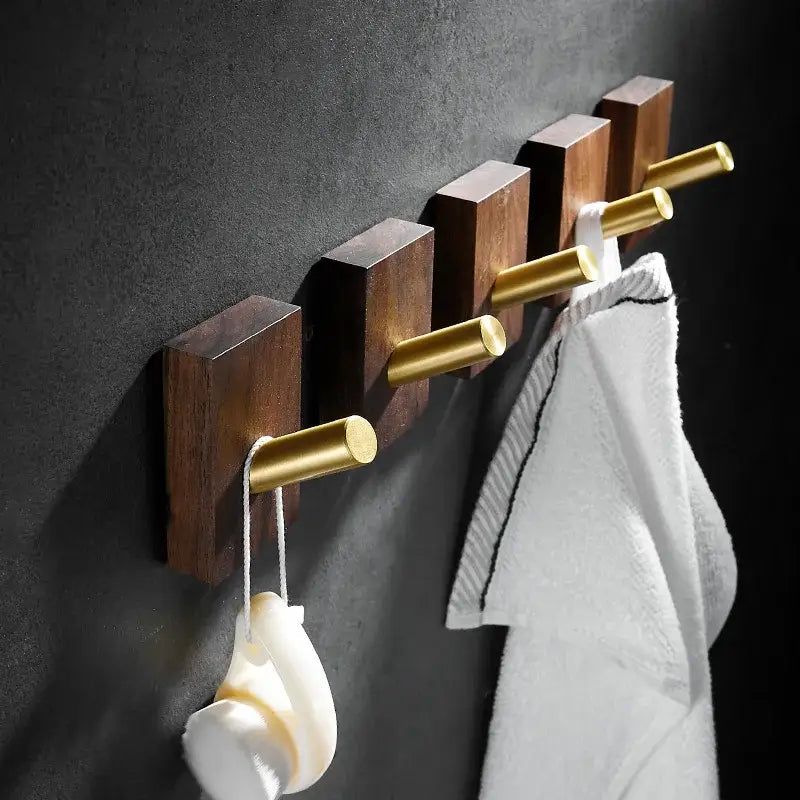 Modern wood and brushed gold wall hook row for kitchen