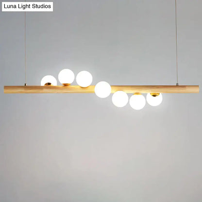 Modern wood and frosted glass suspension light for dining room