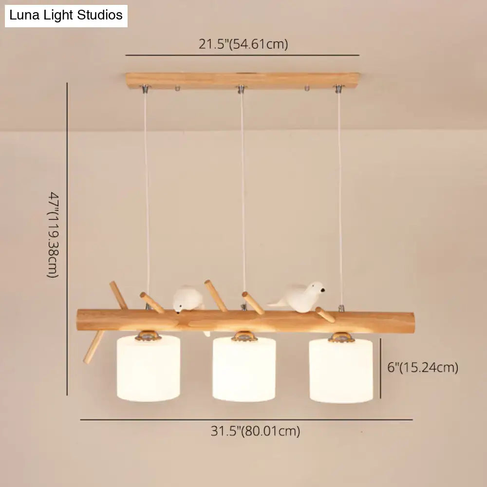 Modern wood cylinder hanging light with birds white glass kitchen