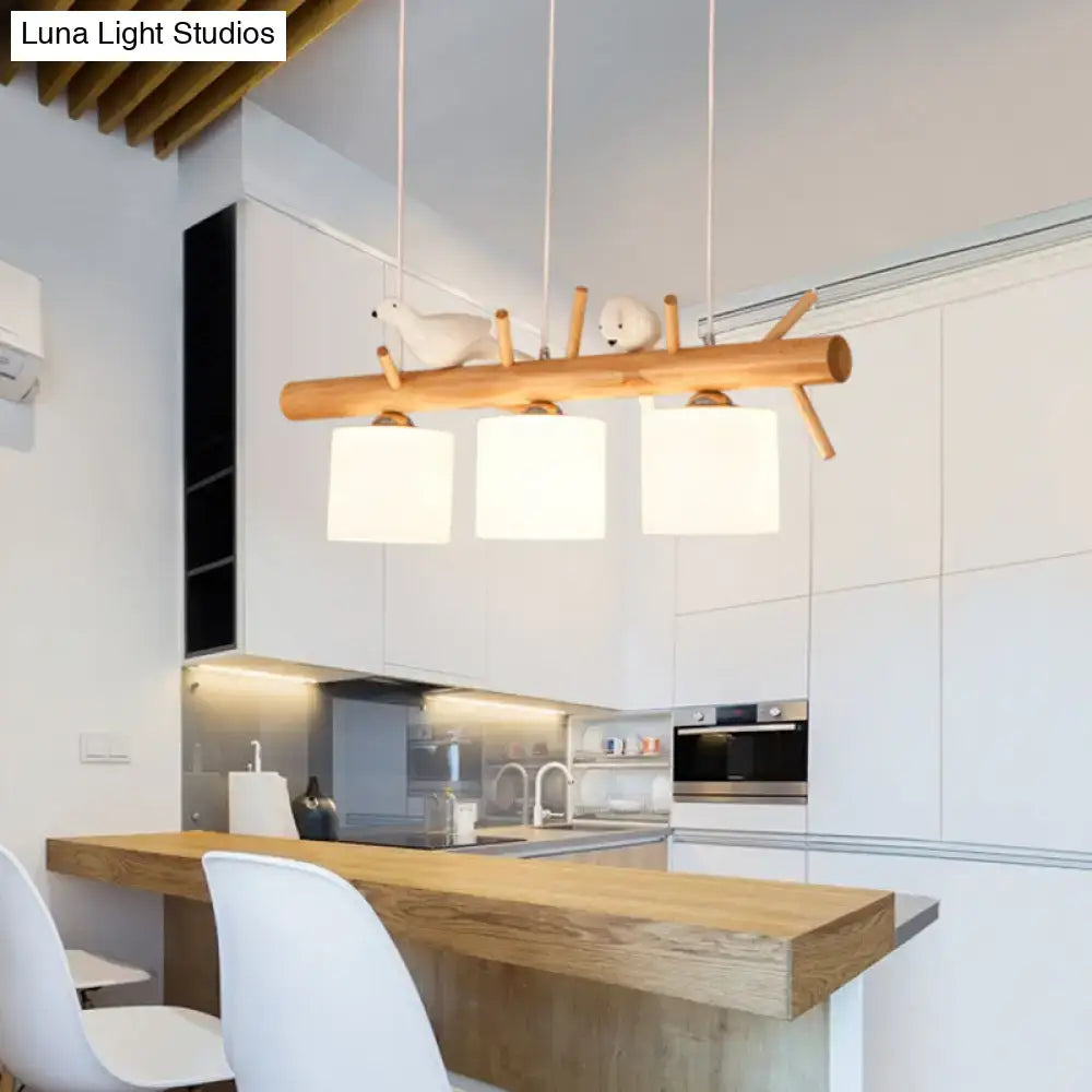 Modern wood cylinder hanging light with birds white glass kitchen