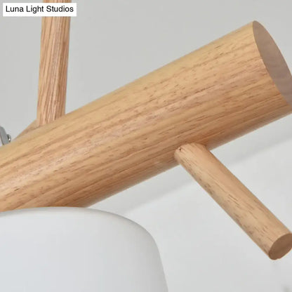 Modern wood cylinder hanging light with birds white glass kitchen
