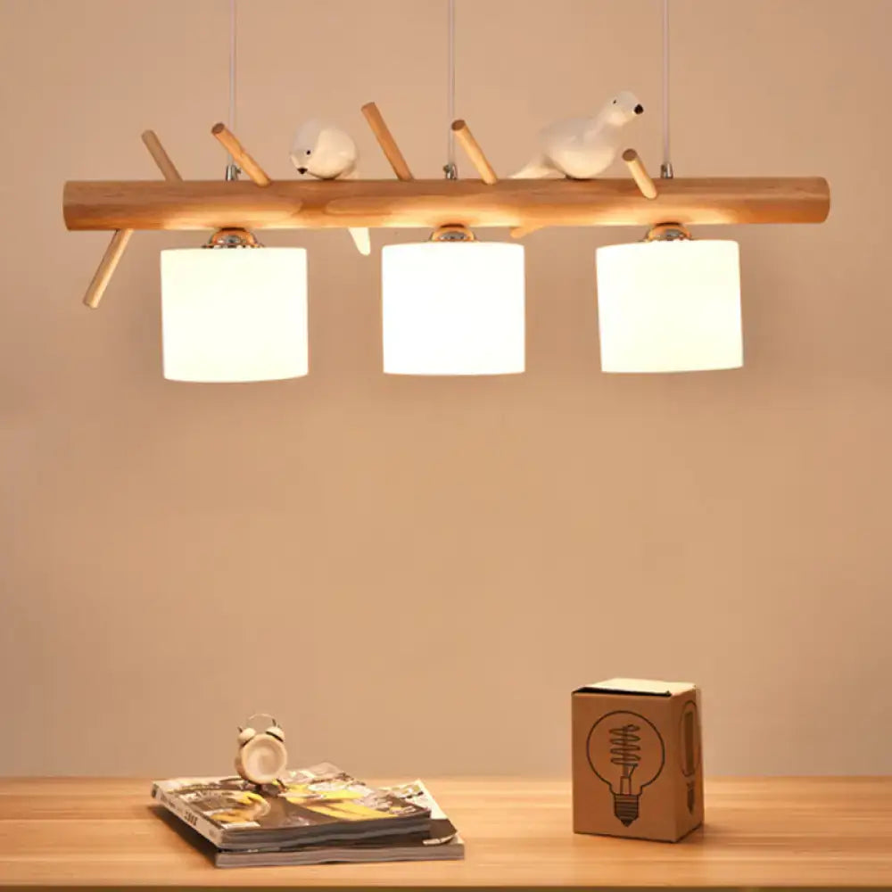 Modern wood cylinder hanging light with birds white glass kitchen