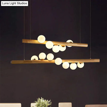 Modern wood island light with opal glass spheres for dining room