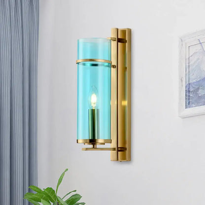Modernist brass and water blue glass bedroom sconce light fixture