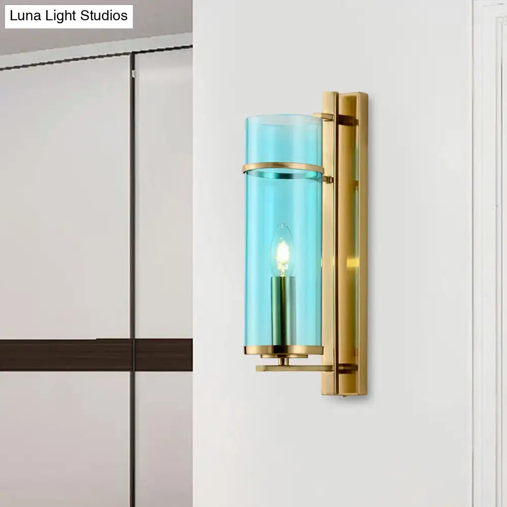Modernist brass and water blue glass bedroom sconce light fixture