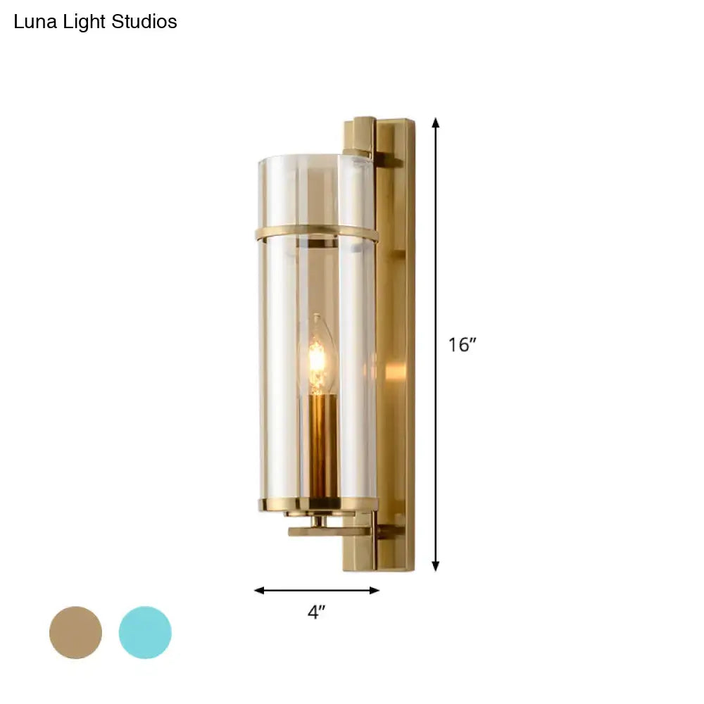 Modernist brass and water blue glass bedroom sconce light fixture