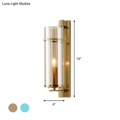 Modernist brass and water blue glass bedroom sconce light fixture