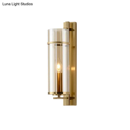 Modernist brass and water blue glass bedroom sconce light fixture