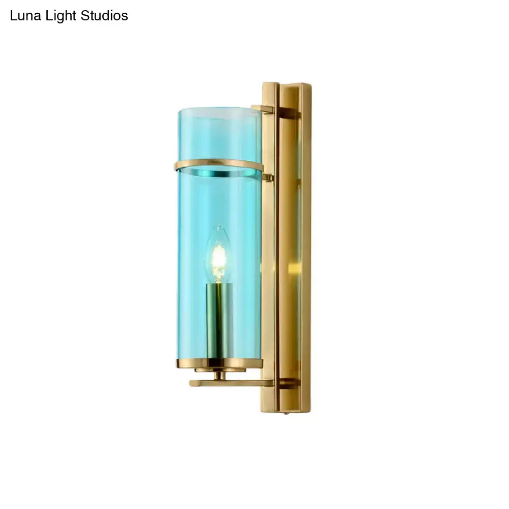 Modernist brass and water blue glass bedroom sconce light fixture