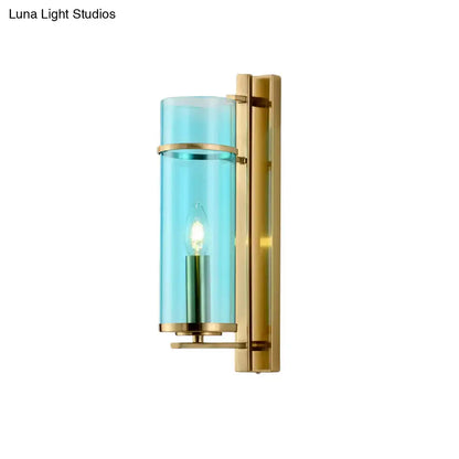 Modernist brass and water blue glass bedroom sconce light fixture