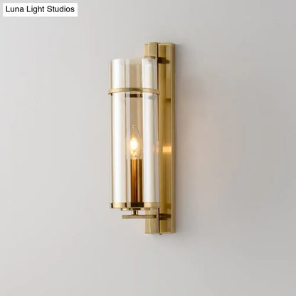 Modernist brass and water blue glass bedroom sconce light fixture