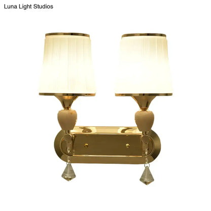 Modernist gold crystal wall sconce with pleated shades living room