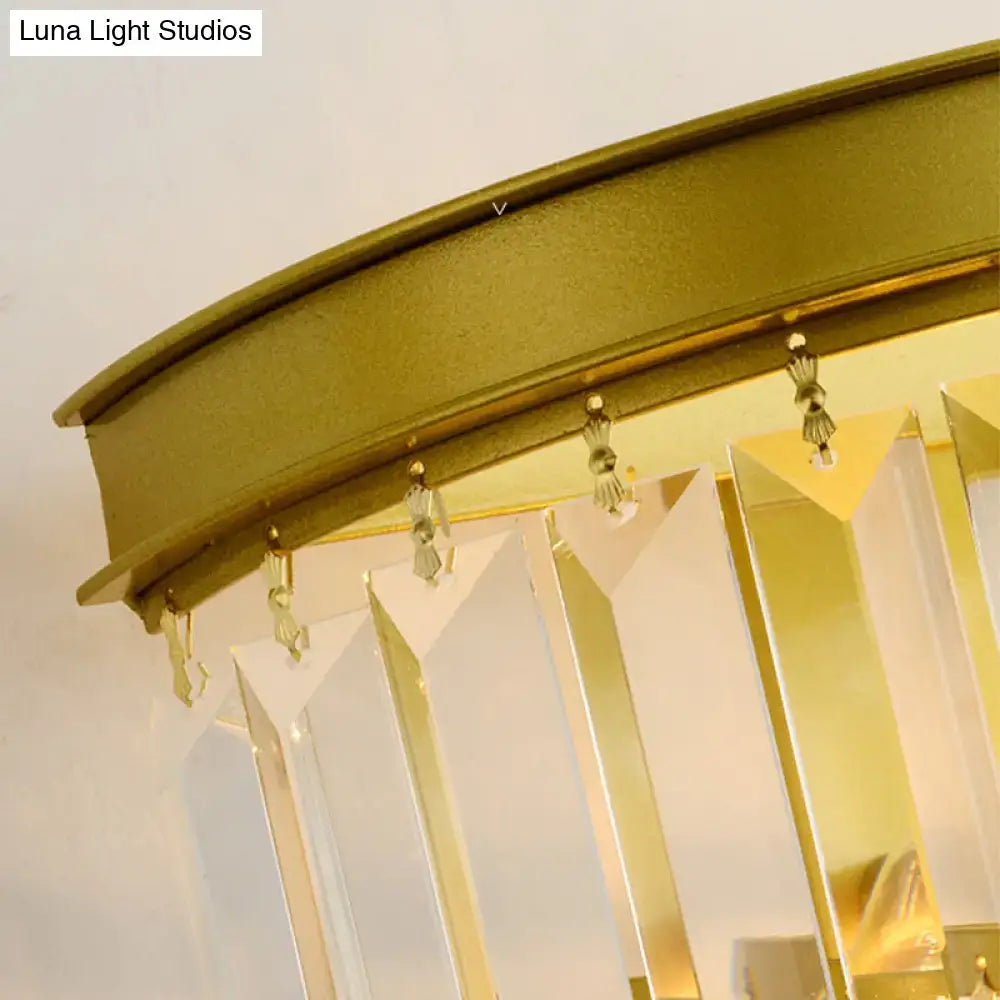 Modernist gold wall lamp with clear faceted crystal for living room