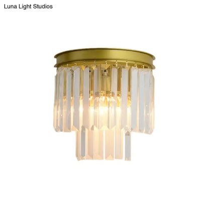 Modernist gold wall lamp with clear faceted crystal for living room