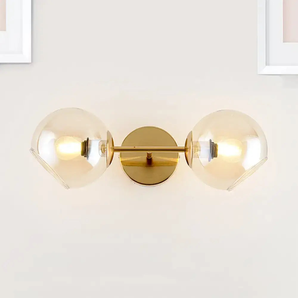 Modernist gold wall lamp with glass shade for living room