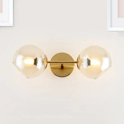 Modernist gold wall lamp with glass shade for living room