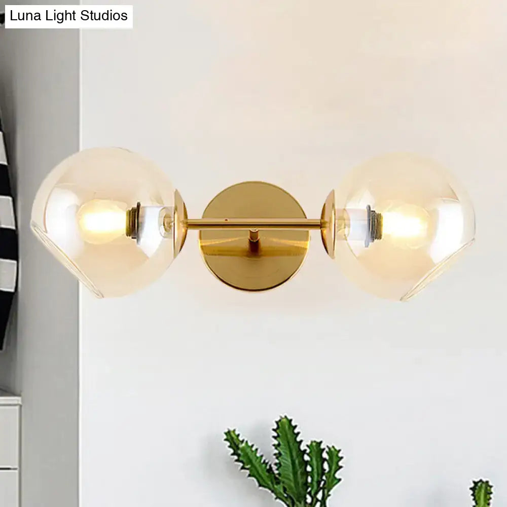 Modernist gold wall lamp with glass shade for living room