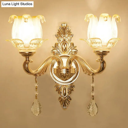 Modernist gold wall sconce with glass shade living room light