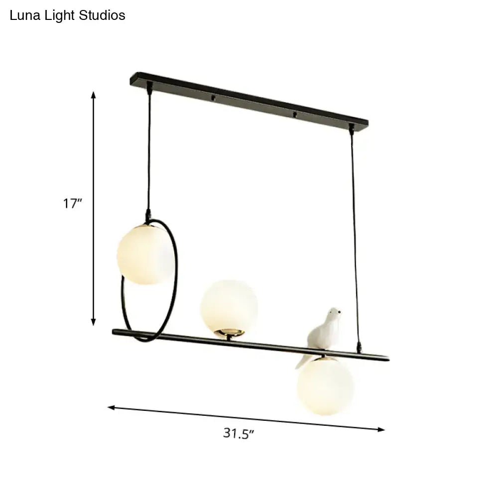 Modernist milk glass pendant with bird accent black dining room light