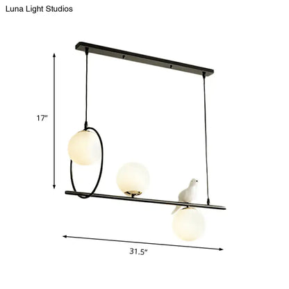 Modernist milk glass pendant with bird accent black dining room light