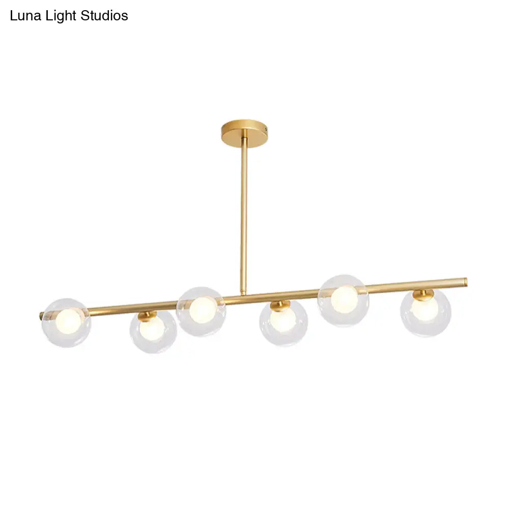 DecorBites™ Nordic Metal 6-Head Linear Island Light with Gold Finish and Clear Glass Globes