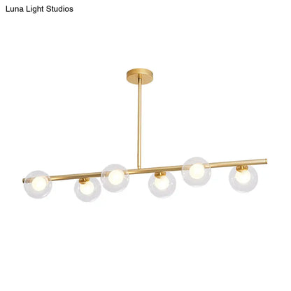 DecorBites™ Nordic Metal 6-Head Linear Island Light with Gold Finish and Clear Glass Globes