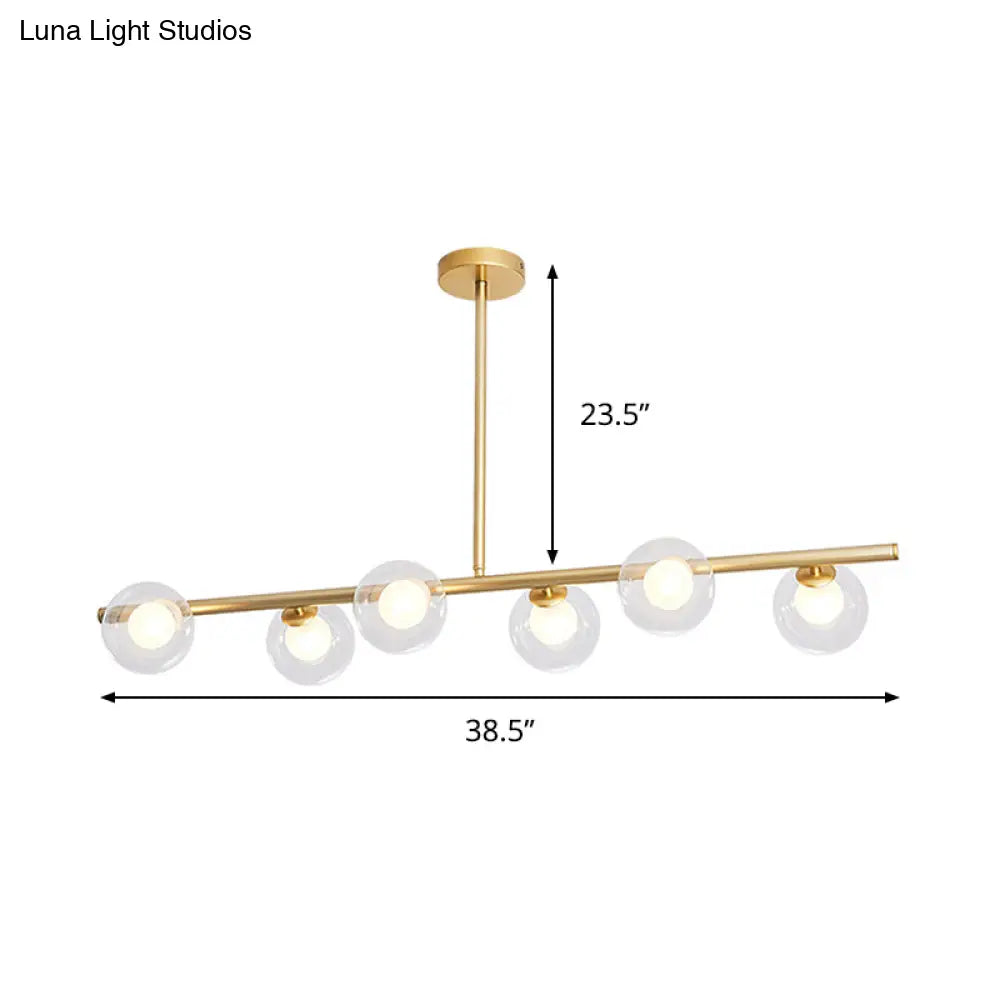 DecorBites™ Nordic Metal 6-Head Linear Island Light with Gold Finish and Clear Glass Globes