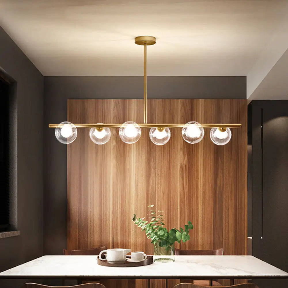 DecorBites™ Nordic Metal 6-Head Linear Island Light with Gold Finish and Clear Glass Globes