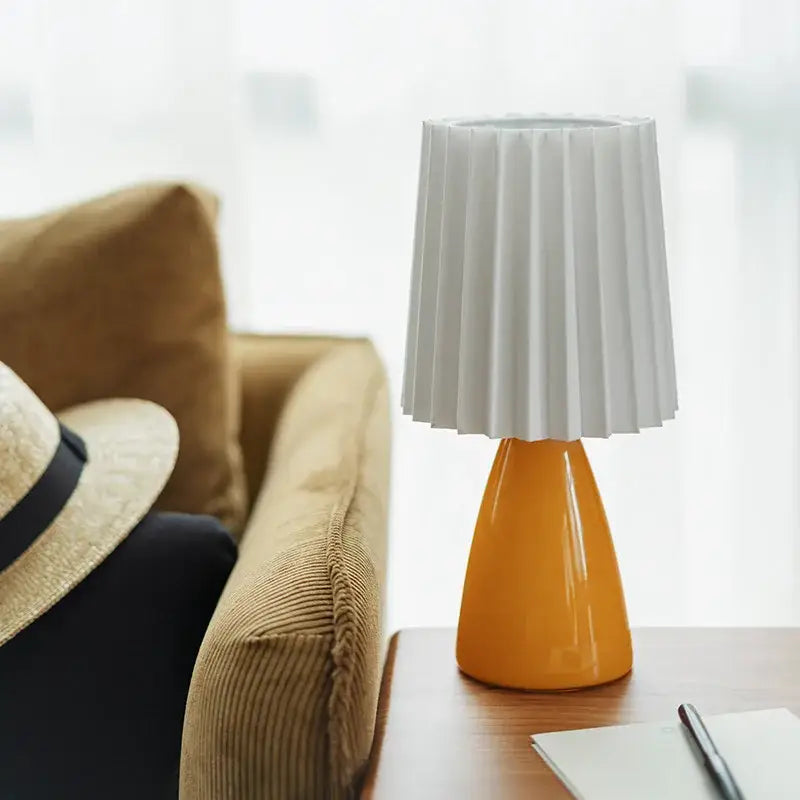 Orange ceramic milkshake bedside lamp with pleated shade for bedroom