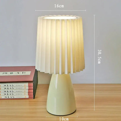 Orange ceramic milkshake bedside lamp with pleated shade for bedroom