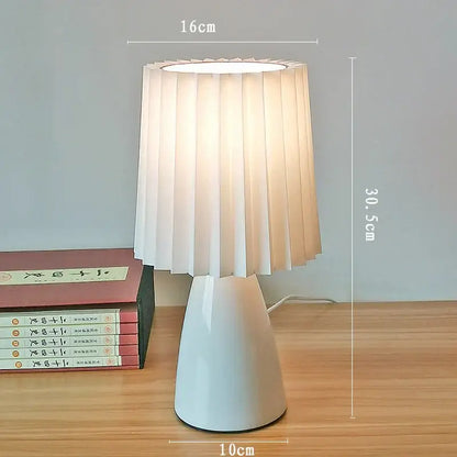 Orange ceramic milkshake bedside lamp with pleated shade for bedroom
