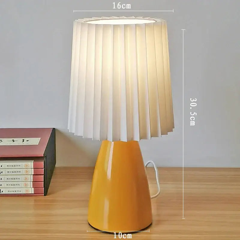 Orange ceramic milkshake bedside lamp with pleated shade for bedroom