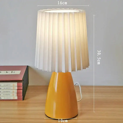 Orange ceramic milkshake bedside lamp with pleated shade for bedroom